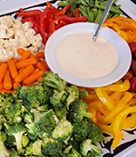 Image of vegetable tray with dip served at a funeral reception